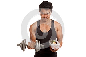 Muscular Asian man with dumbbell and clean food in box