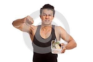 Muscular Asian man thumbs down with clean food in box
