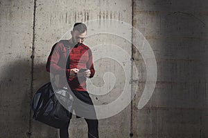 Athletic man using a smart phone photo