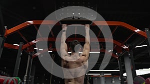 muscular athlete pullup in sport gym, back view. sport athlete with pullup in gym. athlete pullup