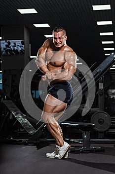 Muscular athletic bodybuilder fitness model posing