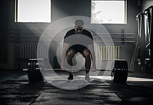 Muscular and Athletic Bodybuilder Lift Barbell .