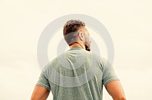 Muscular back man isolated on white. searching for inspiration. planning future goals. rich imagination. standing