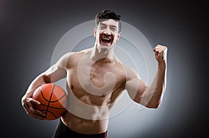 Muscular basketball in sports concept