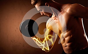 Muscular body builder lifting weight with energy lights on bicep