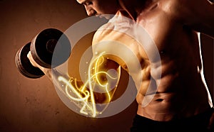 Muscular body builder lifting weight with energy lights on bicep