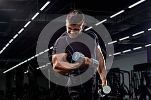 Muscular bodybuilder on black background.Strong athletic man.