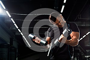 Muscular bodybuilder on black background.Strong athletic man.