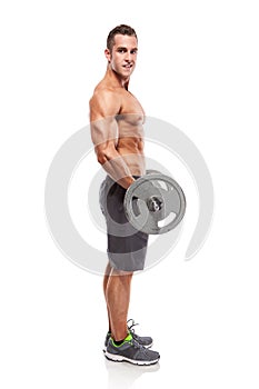 Muscular bodybuilder guy doing exercises with big dumbbell over