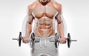 Muscular bodybuilder guy doing exercises with dumbbells