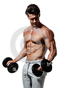 Muscular bodybuilder guy doing exercises with dumbbells
