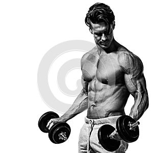 Muscular bodybuilder guy doing exercises with dumbbells