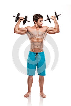 Muscular bodybuilder guy doing exercises with dumbbells over white background