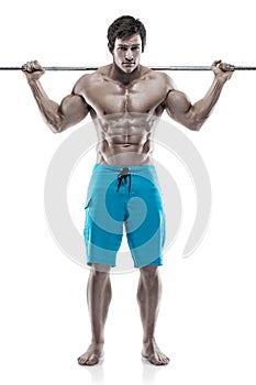 Muscular bodybuilder guy doing exercises with dumbbells over white background
