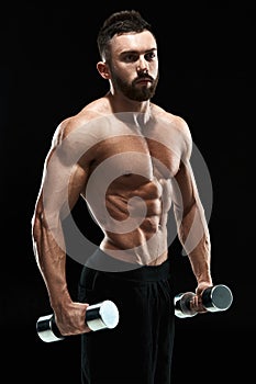 Muscular bodybuilder guy doing posing