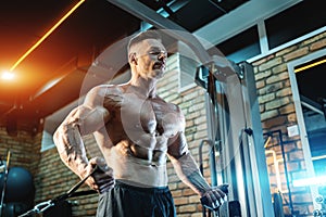 muscular bodybuilder male have workout in gym or training with sport equipment