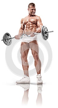 Muscular bodybuilder posing with dumbbell