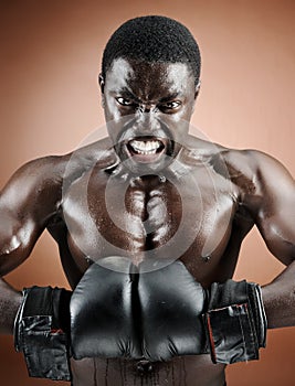Muscular boxer with intense emotion