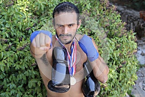 Muscular boxer winning a prize