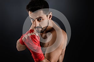 Muscular boxing man ready to fight.