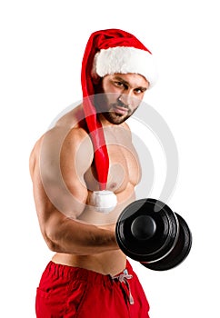 Muscular bronzed handsome Santa Claus on white background, isolated