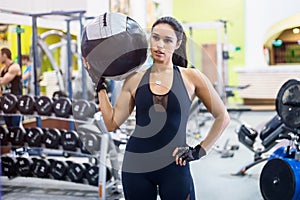 Muscular fit woman workout in gym. Strong female