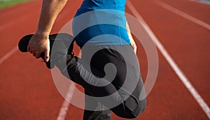 Muscular guy doing stretching before jogging