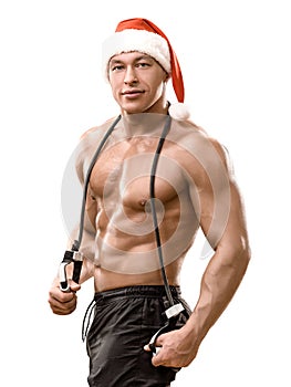 Muscular handsome sexy Santa Claus bodybuilder guy with an expander on his neck