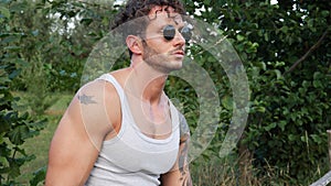 Muscular Hunk Man Outdoor in Countryside with Tanktop