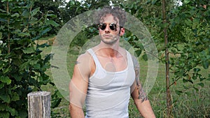 Muscular Hunk Man Outdoor in Countryside with Tanktop