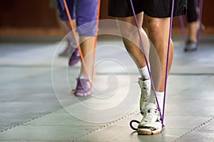 Muscular legs with a resistance band