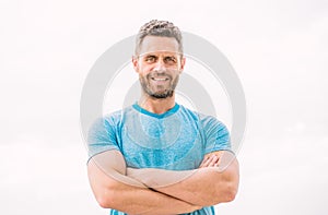 Muscular male with beard. happy man isolated on white. sportsman with athletic body. coach in fitness gym. after workout