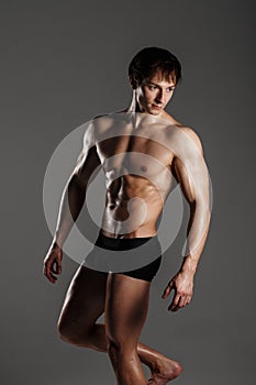 Muscular male model bodybuilder before training. Studio shot on