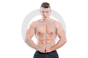 Muscular male model flexing abs and arms