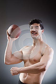 The muscular man with american football