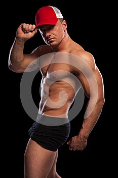 muscular man with baseball cap
