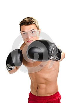 Muscular man boxing