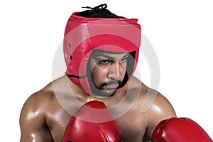 Muscular man boxing in gloves