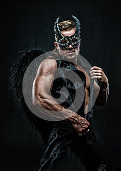 Muscular man in demon costume