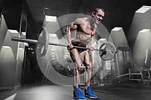 Muscular Man Doing Heavy Deadlift Exercise