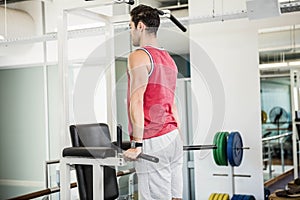 Muscular man doing pull up