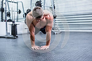 Muscular man doing push-ups