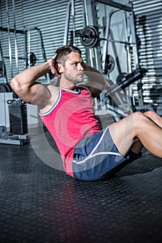 Muscular man doing sit-ups