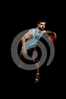 Muscular man dribbling a ball