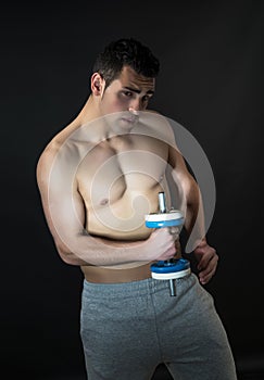 Muscular man with dumbbells