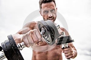 Muscular man exercising with barbell. fitness health diet. man sportsman with strong ab torso. steroids. athletic body