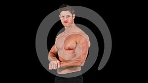 Muscular man flexing muscles in front of camera