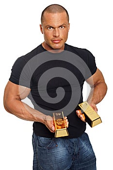 Muscular man with gold brick