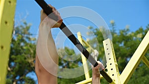 Muscular Man on Horizontal Bar