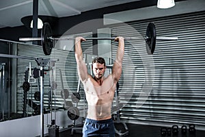 Muscular man lifting a barbell